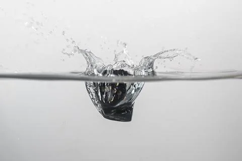 Dice drop in water Stock Photos