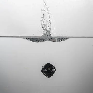 Dice drop in water Stock Photos