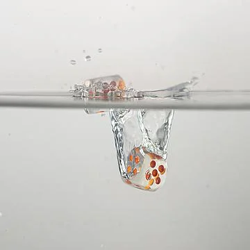 Dice drop in water Stock Photos