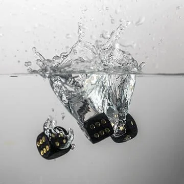 Dice drop in water Stock Photos