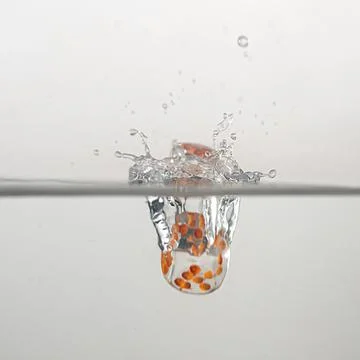Dice drop in water Stock Photos