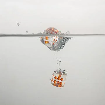 Dice drop in water Stock Photos