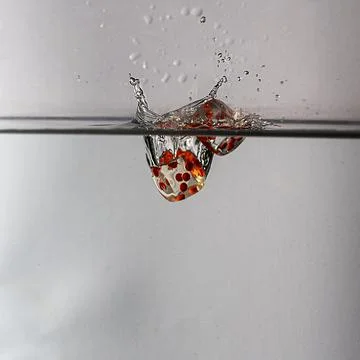 Dice drop in water Stock Photos