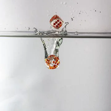Dice drop in water Stock Photos