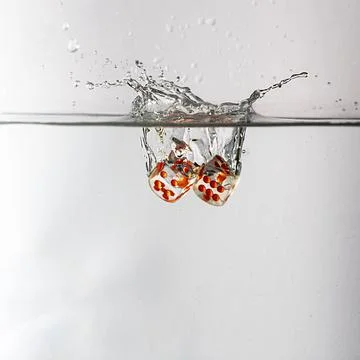 Dice drop in water Stock Photos