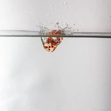 Dice drop in water Stock Photos