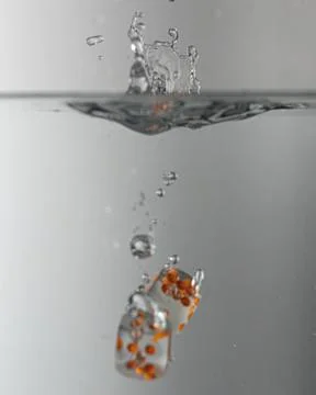 Dice drop in water Stock Photos