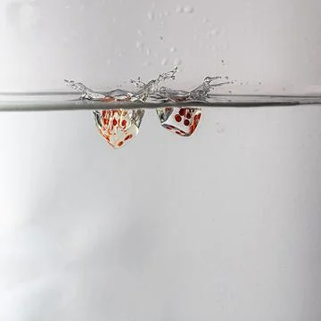 Dice drop in water Stock Photos