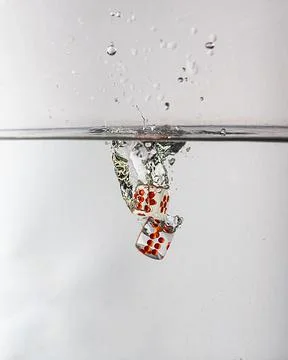 Dice drop in water Stock Photos