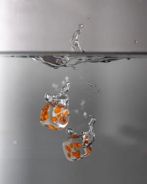Dice drop in water Stock Photos