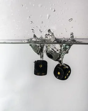 Dice drop in water Stock Photos
