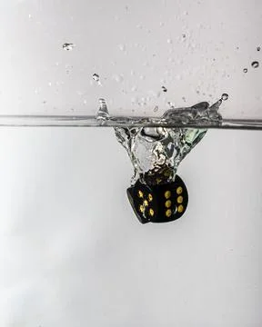 Dice drop in water Stock Photos