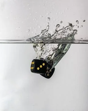 Dice drop in water Stock Photos