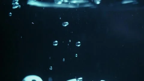 Dice Drops in Water in Slow Motion Creating Bubbles Stock Footage 300892644