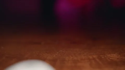 Dice falling in slow motion showing a four Stock Footage 195299029