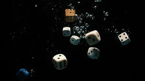 Dice falling slowly into the water 스톡 동영상 130308044