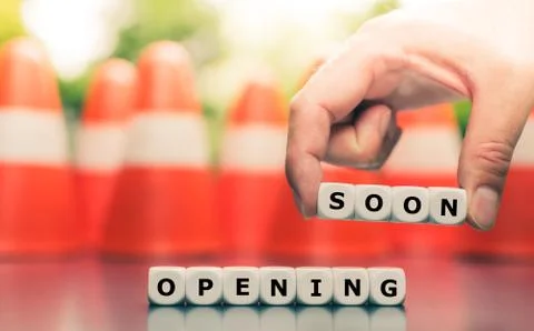 Dice form the expression "opening soon". Stock Photos