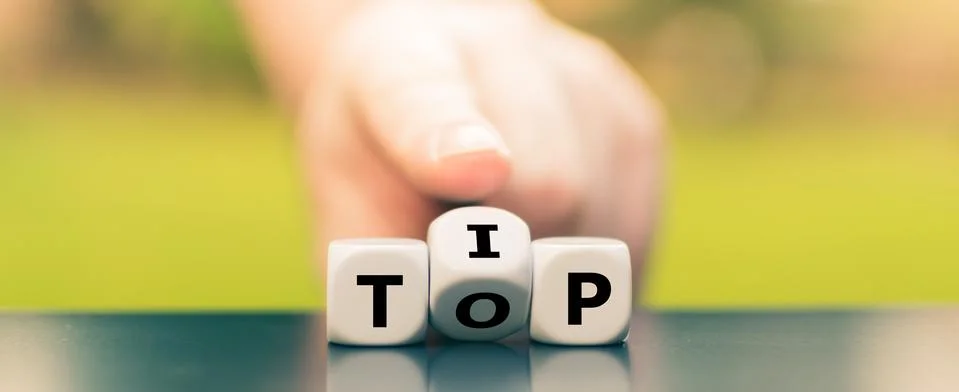 Dice form the expression "tip top". Stock Photos