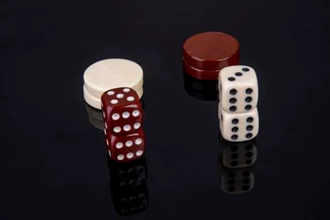 Dice game with dice and game pieces from backgammon Stock Photos