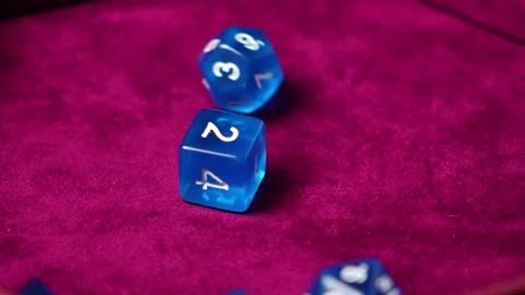 Dice for the game fall on red velvet Stock Footage 321742362