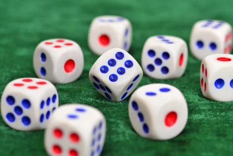 Dice on a green baize Stock Photos