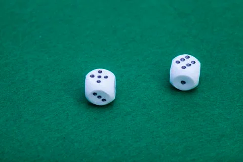 Dice On A Green Felt Table Stock Photos