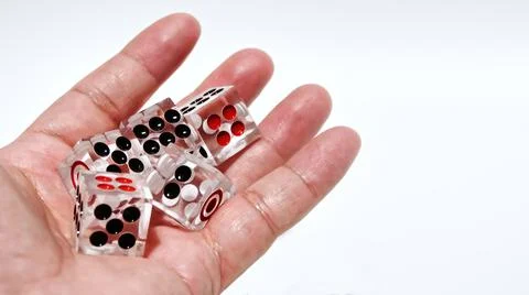 Dice in hand Stock Photos