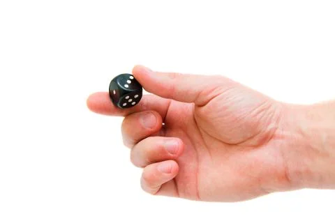 Dice in hand on a white background isolate. Stock Photos