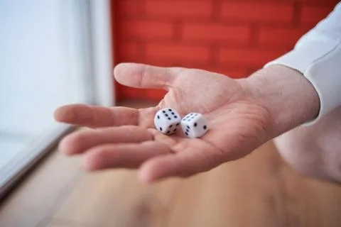 The dice in his hand. Stock Photos