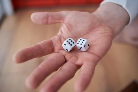 The dice in his hand. Stock Photos