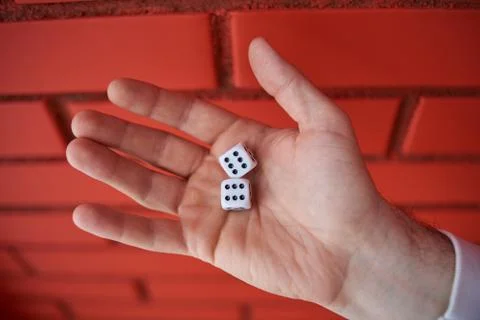 The dice in his hand. Stock Photos