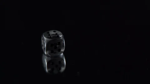 Dice lands on six close up black bachground Stock Footage 123047836
