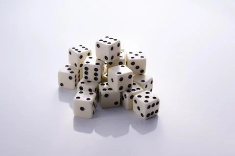 Dice on a light background Stock Photos