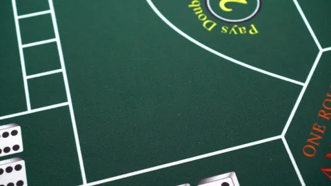 Dice move on poker table by stick craps give to gambler Stock Footage 109067649