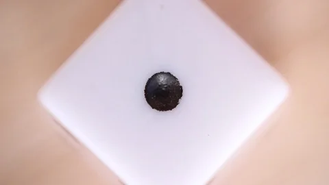 Dice number one under macro focus Video stock 98480473