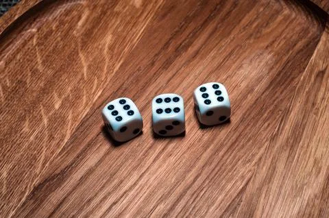 Dice on old wood table white number risk game Stock Photos