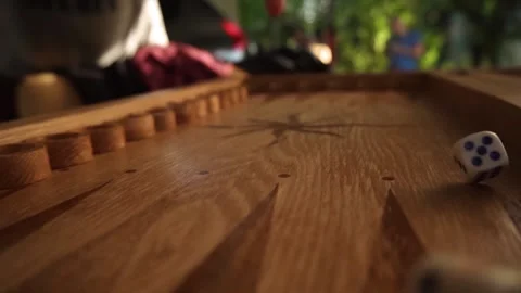 Dice for playing backgammon fall on a wooden board, hit the boards and bounce Stock Footage 161082760