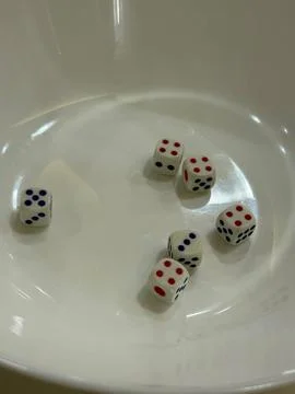 Dice Roll Captures Casual Moment At Table Stock Photos