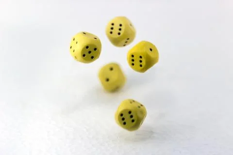Dice roll in flight on white background Stock Photos