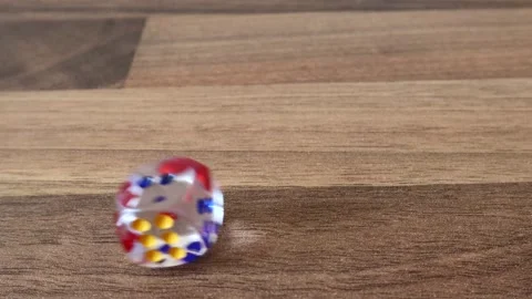 A Dice Roll On A wooden Surface 스톡 동영상 133524247