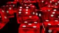Dice rolling red slow motion closeup DOF on black HD Footage