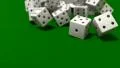 Dice rolling white slow motion closeup DOF on green felt tabletop HD Footage