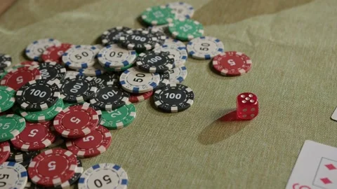 A dice rolls across the poker table Stock Footage 226222489