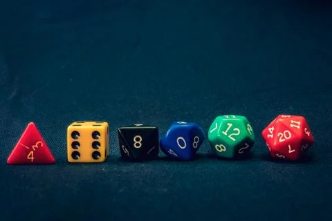 Dice set of 6 line up on table with numbers facing Stock Photos