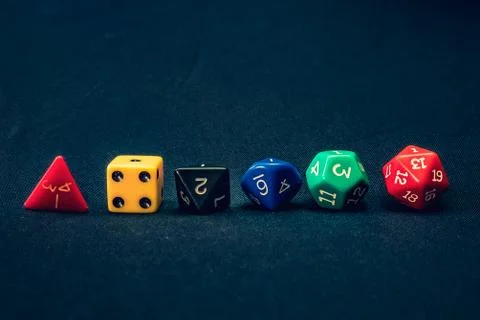 Dice set of 6 line up on table with 1 facing up Stock Photos