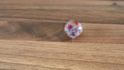 A dice Spinning On a Wooden Surface Video stock 133524281