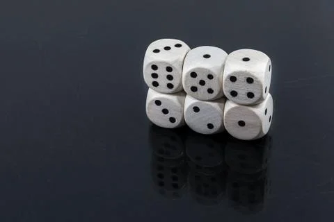 Dice straight: one, two, three, four, five on a black background Stock Photos