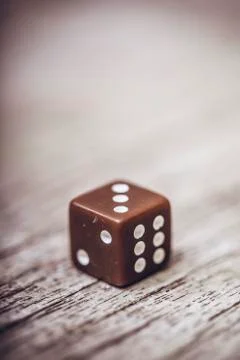 Dice on table, vintage effect. Background for casino games, gambling, luck or Stock Photos