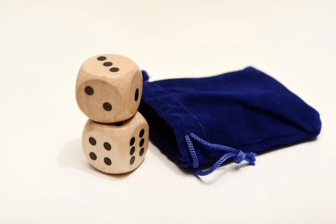 Dice on a white background. Large and small dice. Stock Photos