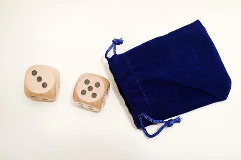 Dice on a white background. Large and small dice. Stock Photos